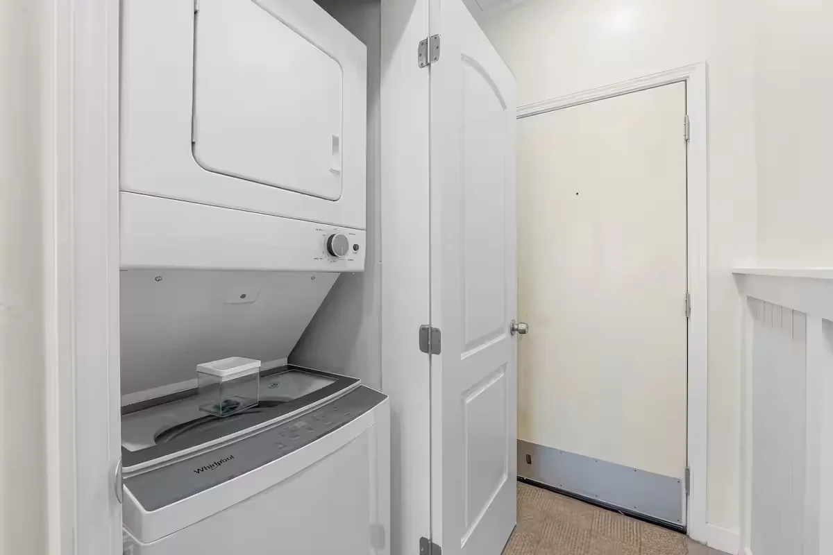 Stacked washer and dryer in a laundry closet