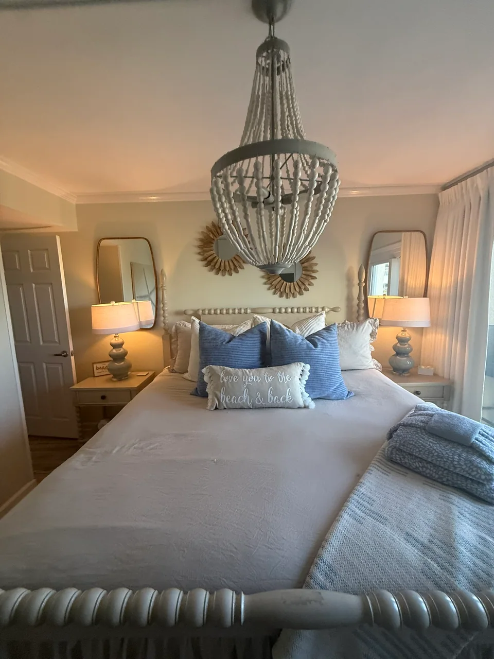 Furnished bedroom with a coastal blue and white palette