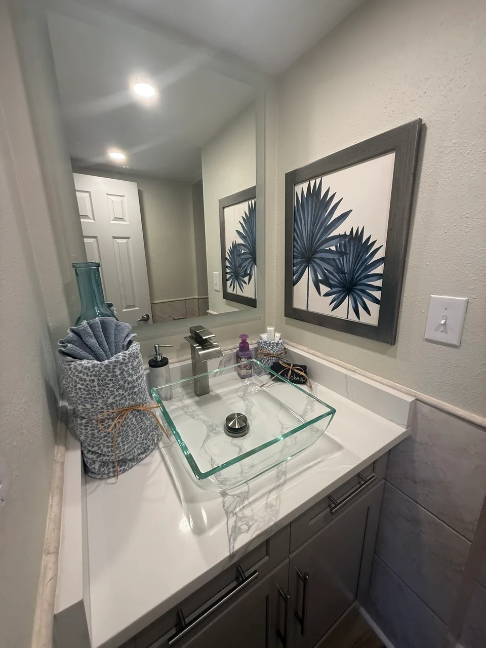 Bathroom vanity with mirror and lighting
